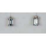 A pair of 9ct white gold aquamarine and diamond stud earrings.