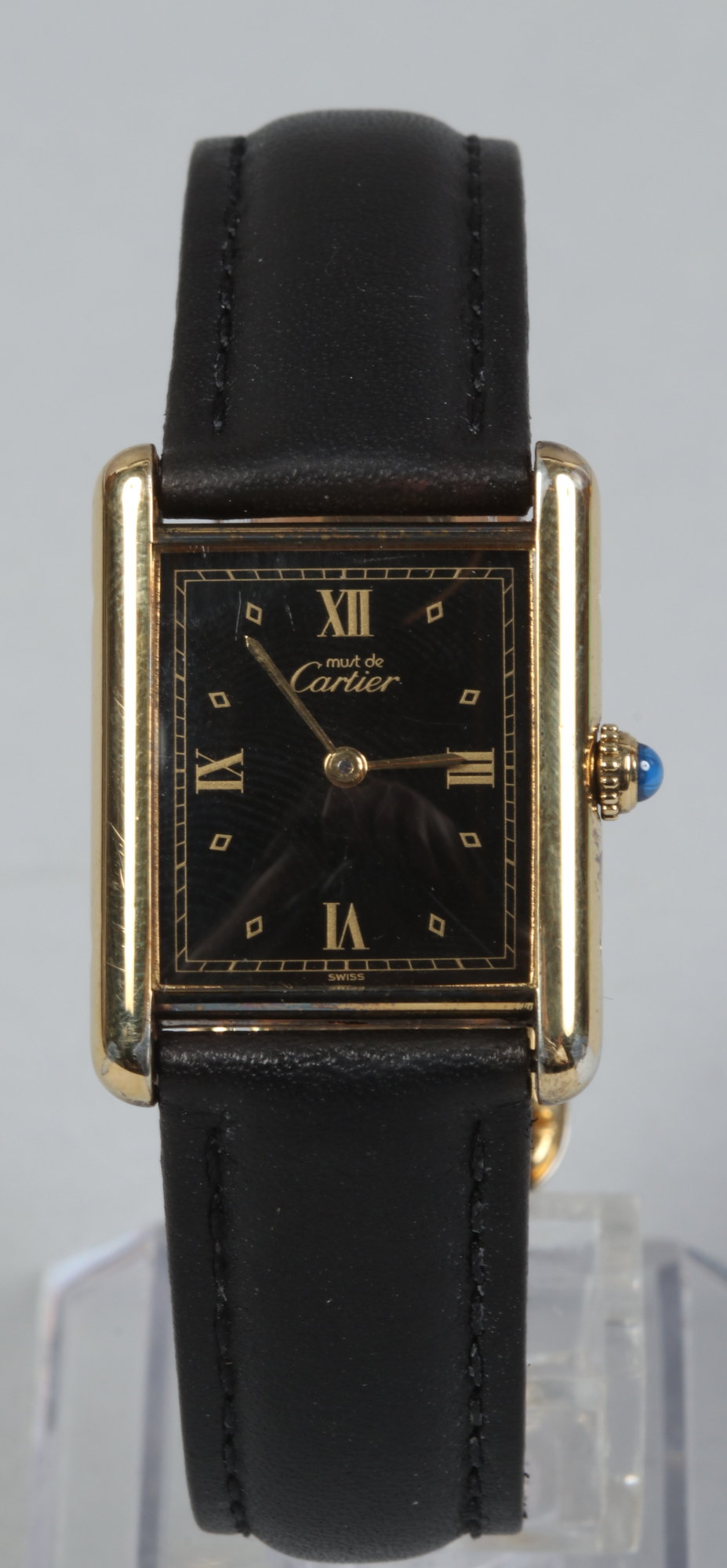 A cased silver gilt quartz Cartier wristwatch with leather strap.