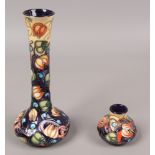 Two Moorcroft vases in the Celtic Web design including a squat example along with a bottle vase,