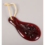 A red art glass suncatcher possibly Scandinavian