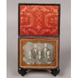 A Victorian cased daguerreotype of five gentleman. (8.2cm x 10.9cm).