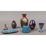 A quantity of cloisonne ware including a red ground baluster shaped vase, trinket dish etc.