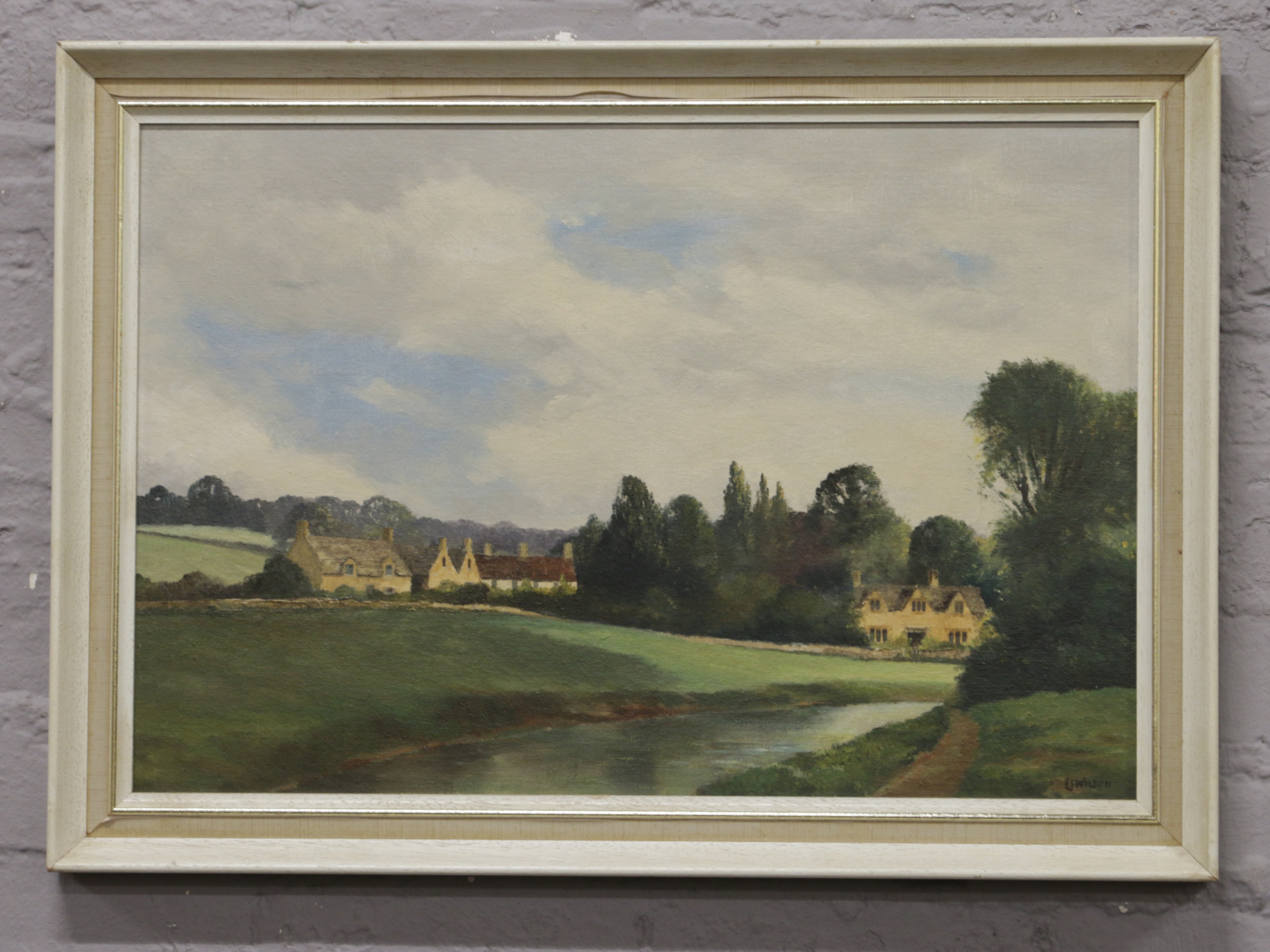 An E. J. Wilson framed oil on board, river landscape scene.