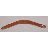 An Australian boomerang carved with native animals.