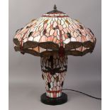 A Tiffany style dragonfly tablelamp with illuminating stem, 60cm High x 52cm Diameter shade.