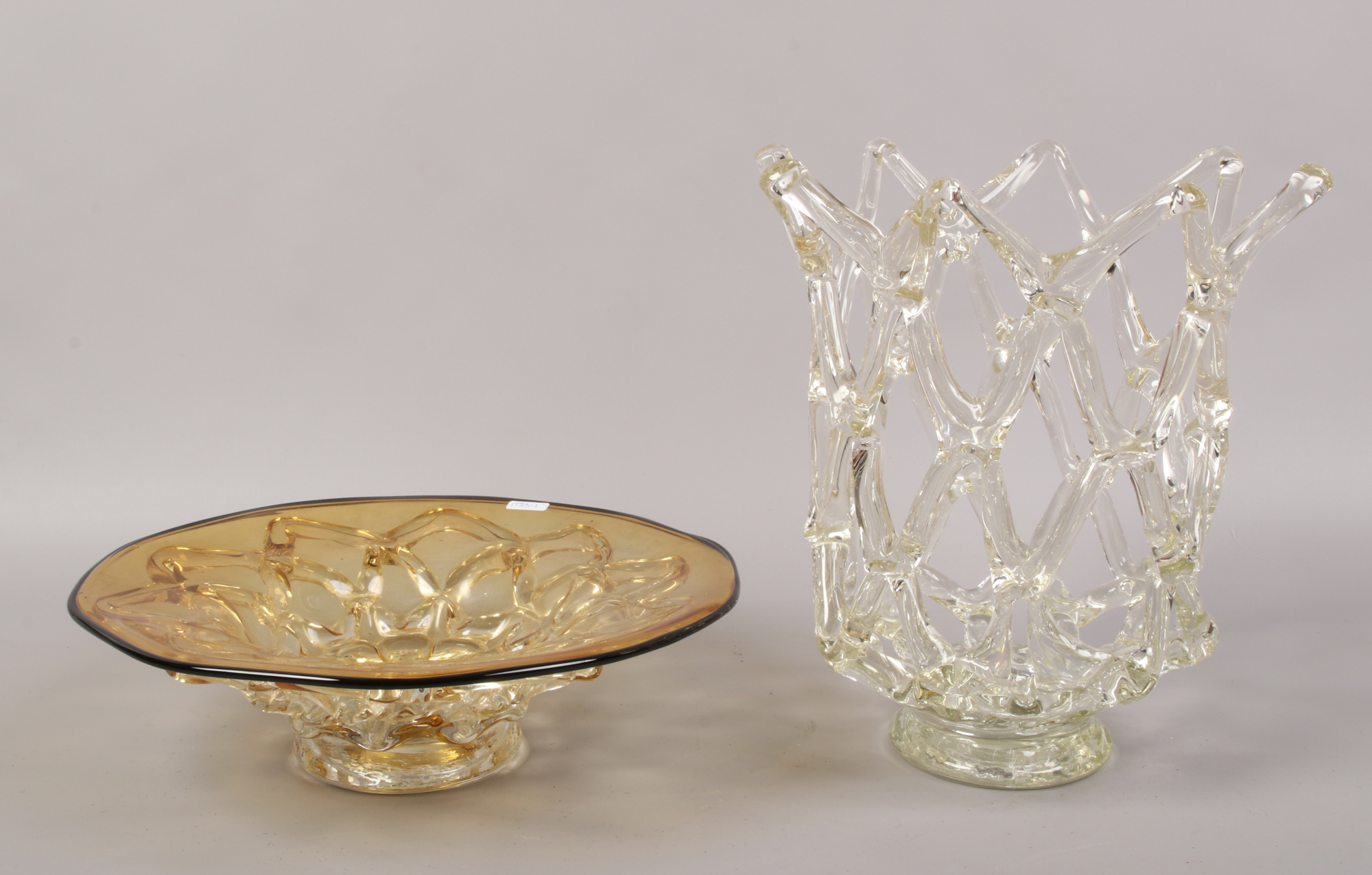 A large openwork glass vase, H 31cm diameter 30cm along with amber glass bowl with a similar design,