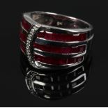 A 9ct white gold Art Deco style ruby and diamond dress ring, of buckle form, size N.
