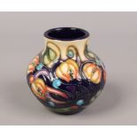 A Moorcroft squat vase in the Celtic Web design. (Height approx 8.5cm).Condition report intended