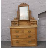 A carved pine dressing table over four drawer chest.Condition report intended as a guide only.In