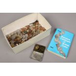 A box of British and Foreign coins to include USA and Canada, along with a Seaby standard