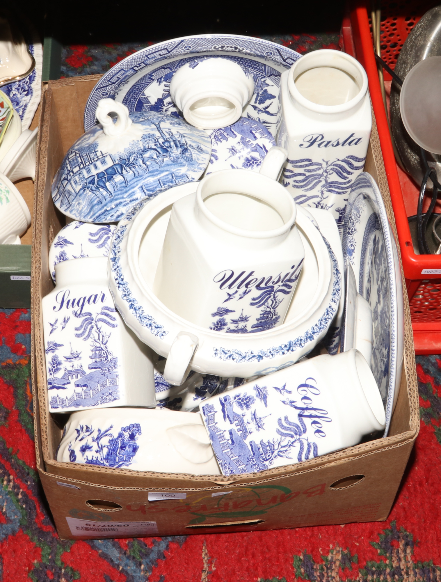 A box of blue and white dinnerwares and storage jars, to include Regal Blue Willow, Churchill etc.