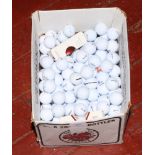 A box of mainly Srixon golf balls.