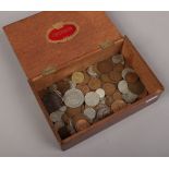 A box of mainly British pre-decimal coins.