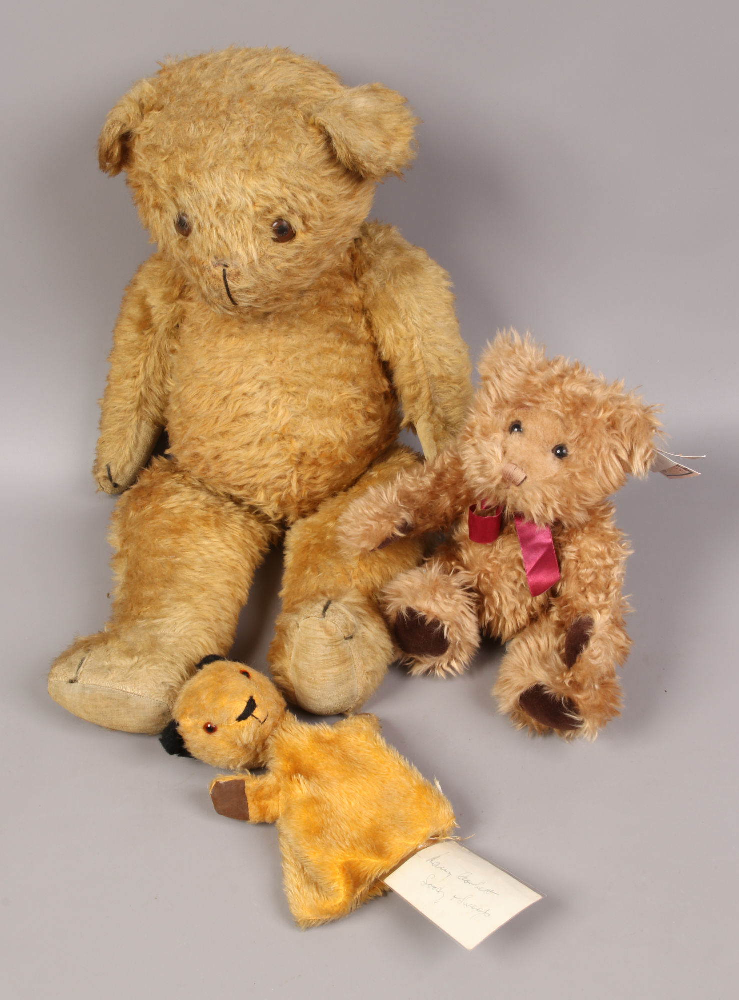 Three teddies to include Sooty hand puppet, purportedly signed by Harry Corbett.