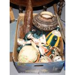 A box of miscellaneous including ceramics, bisque doll, African carved figure and a street lamp.