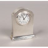 A George V silver cased bedside timepiece by Adie Bros. Ltd. With enamel dial and subsidiary