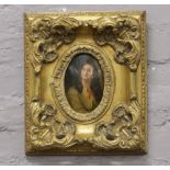 An ornate gilt framed oil on board of a young girl, signed M. Pauly.