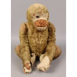 A vintage jointed mohair monkey.