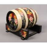 A bargeware decorated oak metal bound sherry cask and stand.