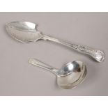 A Georgian silver caddy spoon, along with a silver jam spoon.