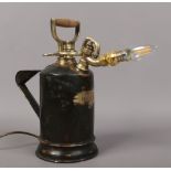 A painted brass pressure spray converted to novelty lamp.