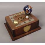 An Orrey clockwork solar system desk clock, repestensing the earth, sun and moon and with copper