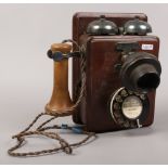 A vintage wooden Rotary dial wall phone. UK postage approx £30.