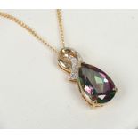 A 9ct gold mystic topaz and diamond pendant with scroll shaped bale on chain.