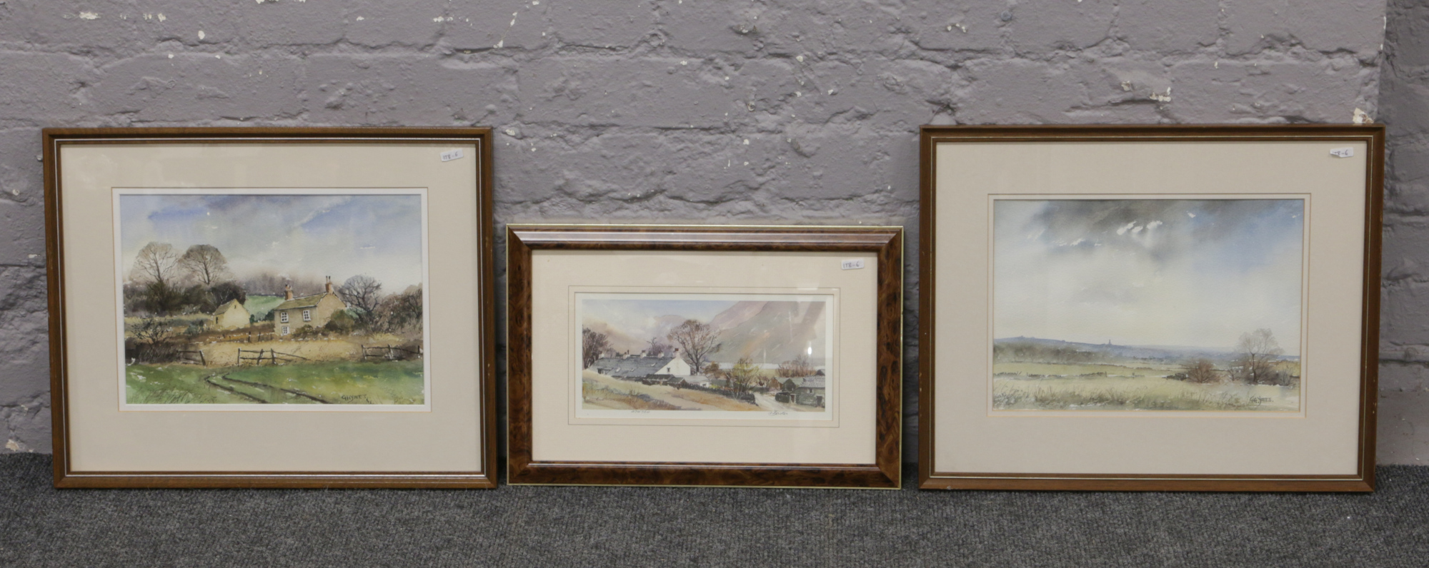 Two framed G. H. Yates watercolours, rural landscapes scenes, along with a similar H. Baxter limited