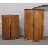 Two Georgian oak and mahogany corner cupboards with painted interiors, keys in office.