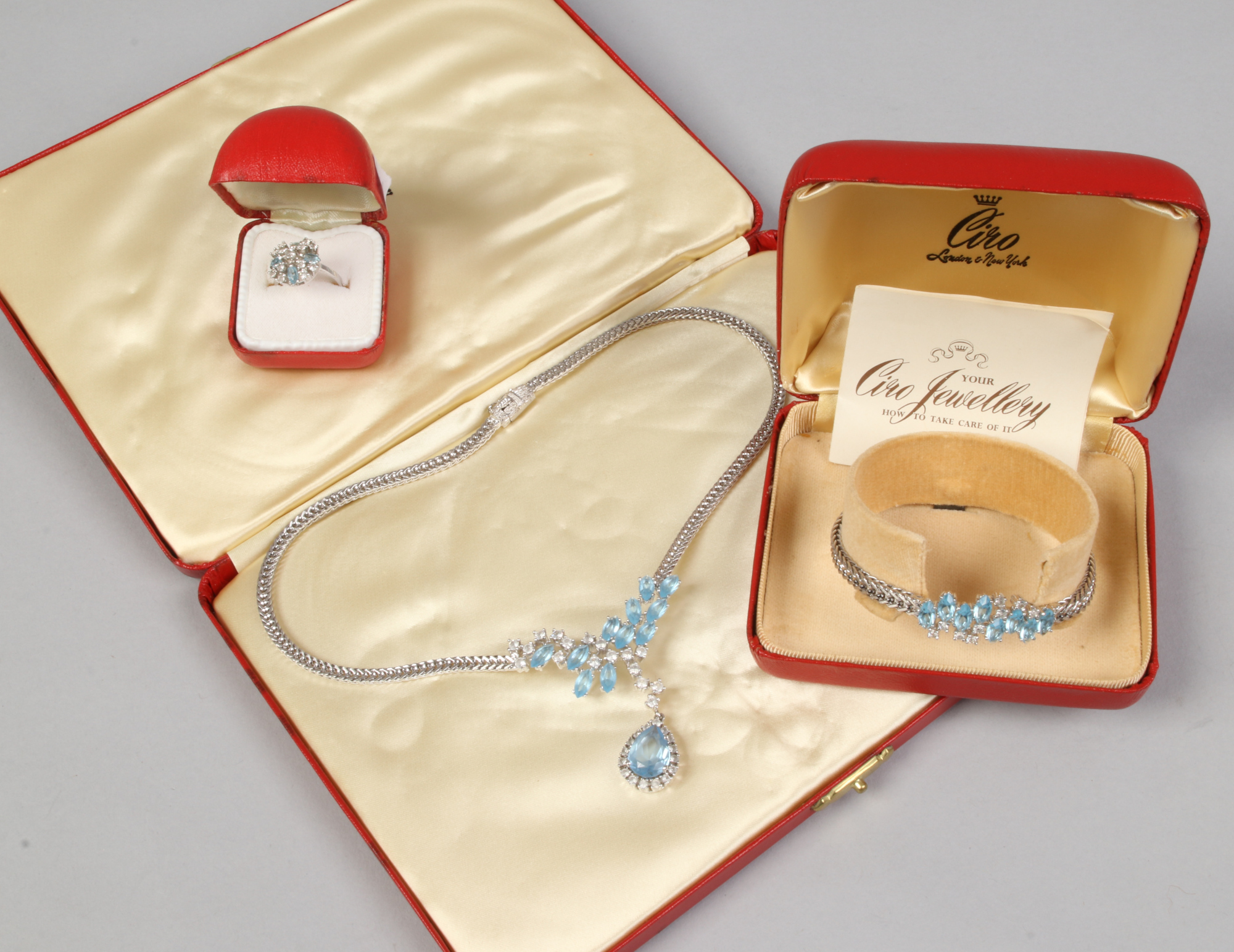 A cased suite of silver dress jewellery, set with white and pale blue paste stones by Ciro including