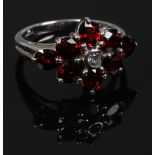 A 9ct white gold garnet and topaz cluster ring with certificate size N.