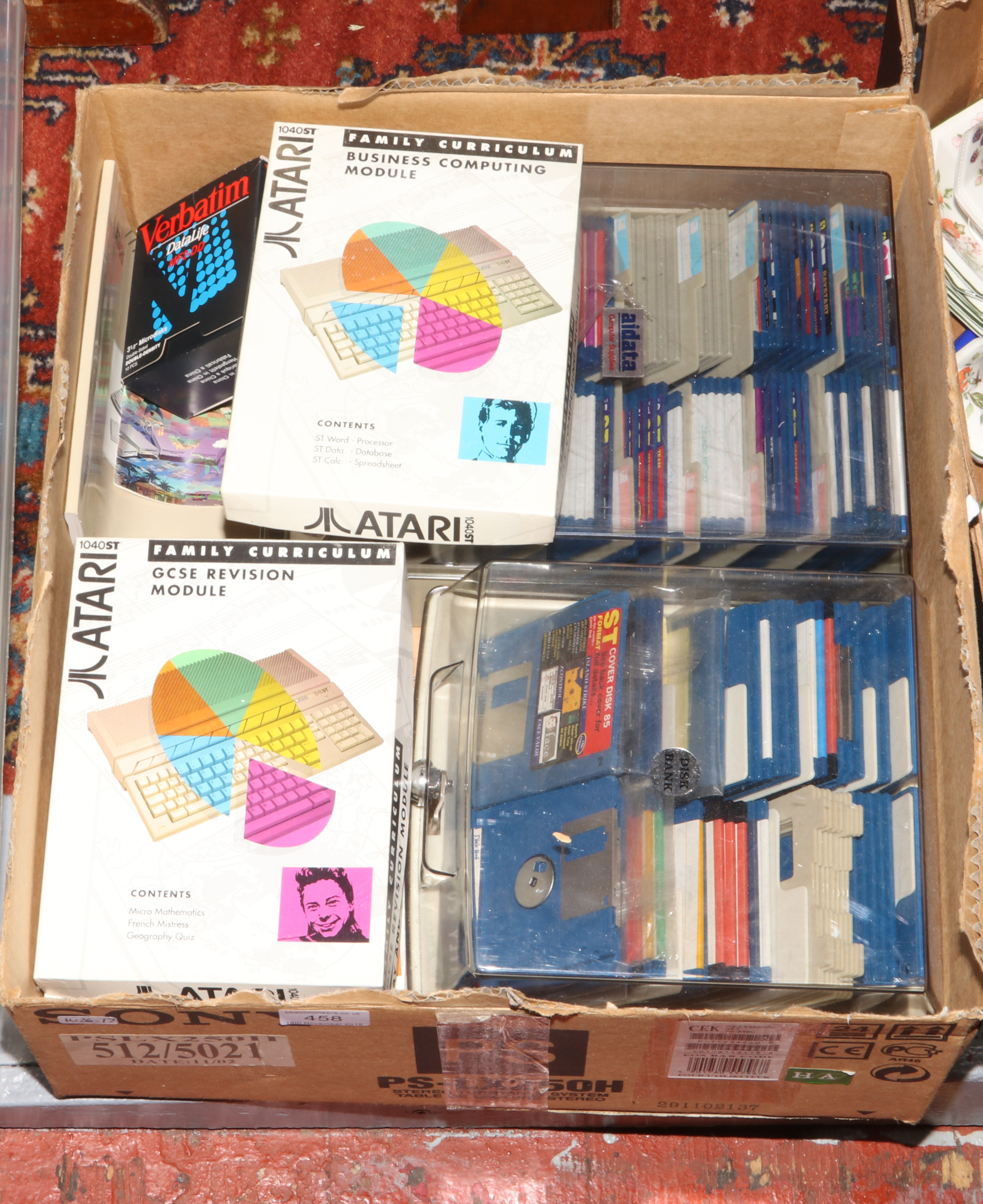 A box of Atari 1040ST family curriculum discs etc.