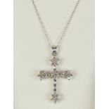 A 14ct white gold and diamond cross pendant on chain, 0.5ct total diamond weight.