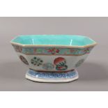 An antique Chinese square cantered bowl decorated in coloured enamels seal mark to the base.