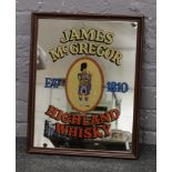 A framed advertising mirror for James McGregor Highland Whisky.