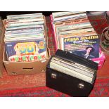 Two boxes and a carry case of records to include meat loaf, Bing Crosby, Johnny Cash etc.