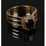 A 14ct gold sapphire and diamond engagement ring, size N.