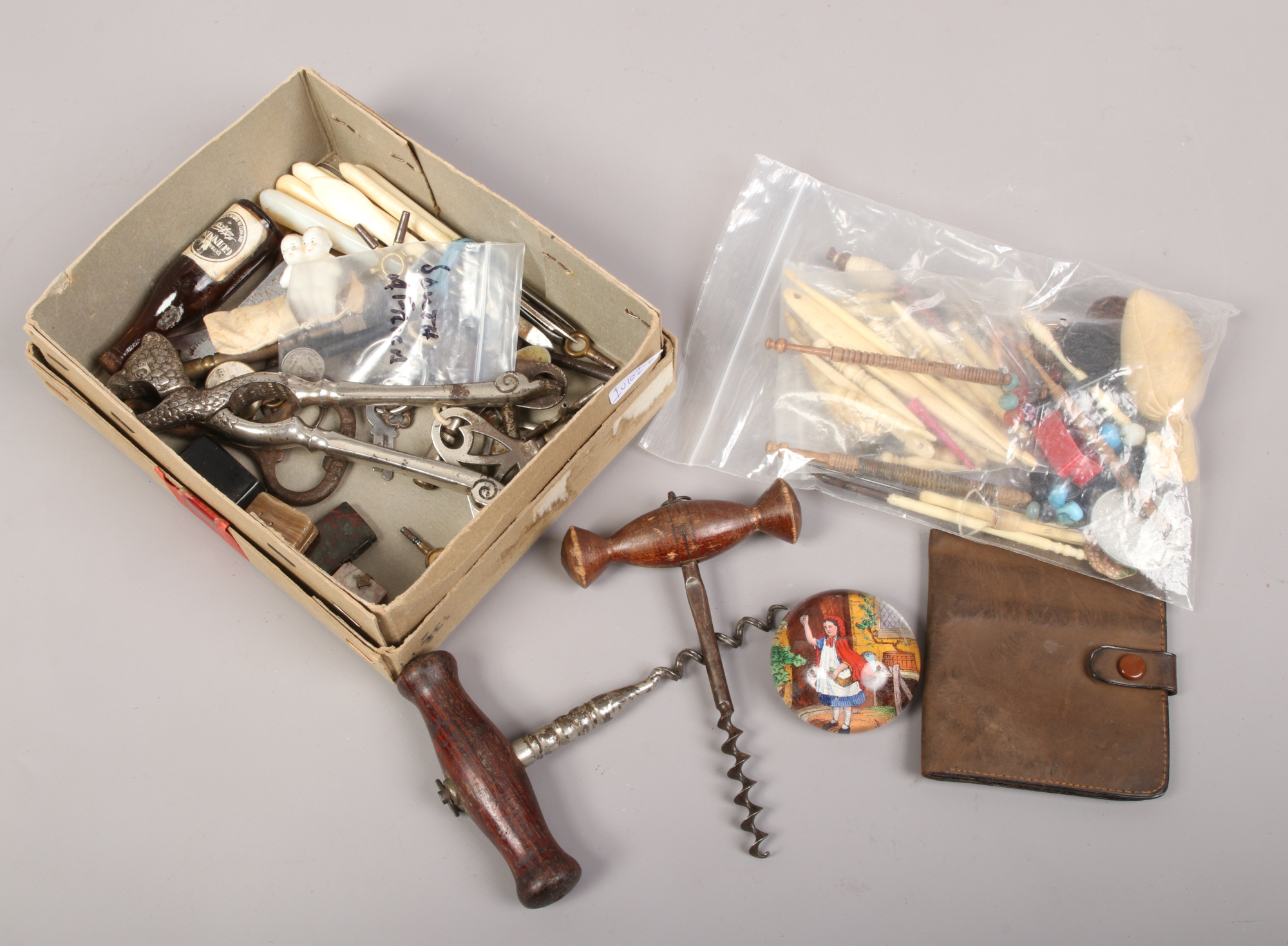 A quantity of mostly vintage and antique collectables including carved bone and wood sewing