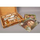 A Winsor & Newton artist art box and contents to include oil paints, artist painting magazine etc.