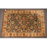 An Indian green ground wool rug with floral design 181 x 122cm.