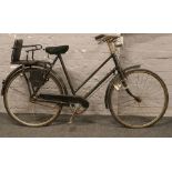 A vintage ladies Elswick hopper bicycle fitted with 3 speed gears, child seat and Dynamo lights.