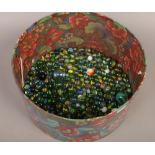 A box of marbles of various sizes polychrome and vintage.