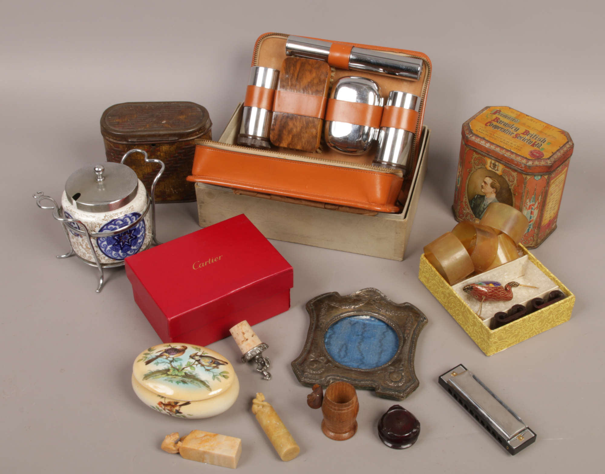 A box of collectables to include silver photo frame, vintage dominoes, Cartier letter and