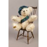 A Merrythought Limited edition Hogmanay teddy bear in Windsor armchair.