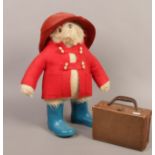 A Gabrielle design Paddington Bear soft toy c.1980 with hat overcoat, wellingtons and suitcase.