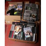 Three boxes of DVDs and CDs.