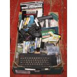 A quantity of Sinclair ZX Spectrum and gaming equipment including keyboard, instruction manual,