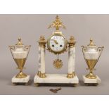 A French style brass and alabaster clock garniture with enamel dial and striking on a bell.