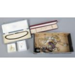 A box of costume jewellery to include simulated pearls, rings, manual nurses watch etc.